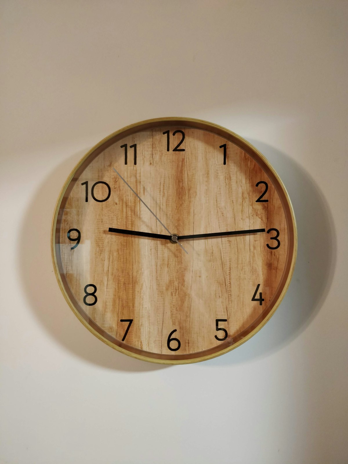 Brown wooden round wall clock
