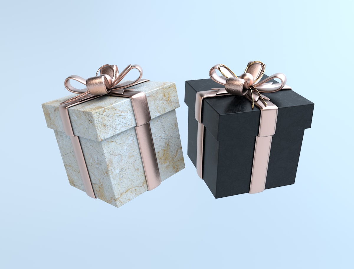 Black and white gift boxes with gold bows