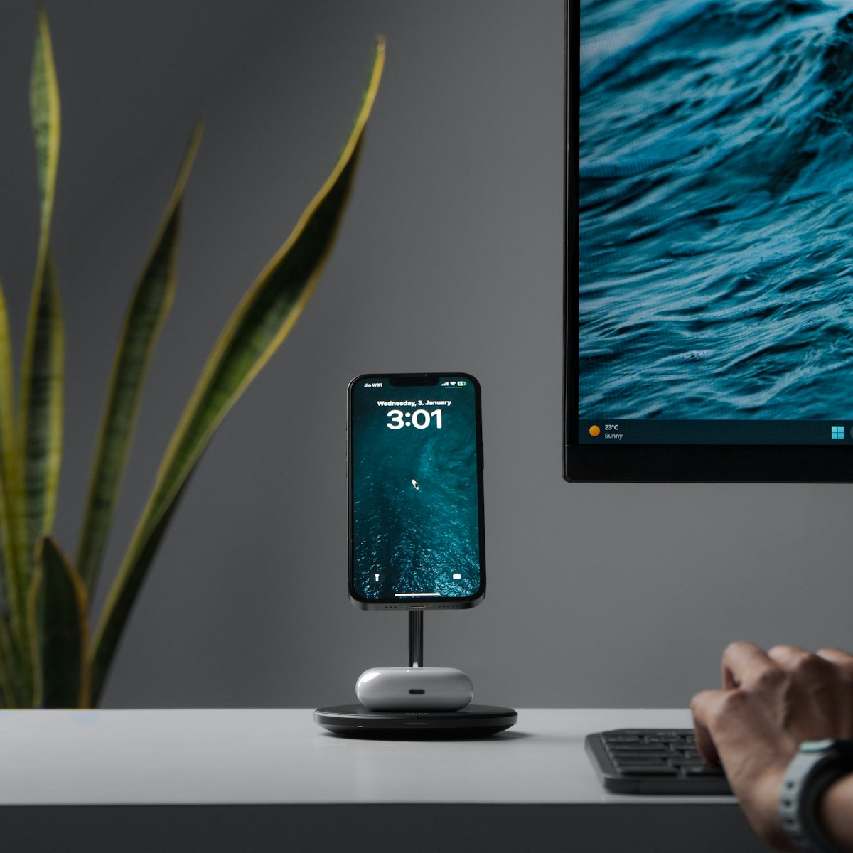 Person at desk working on laptop setup