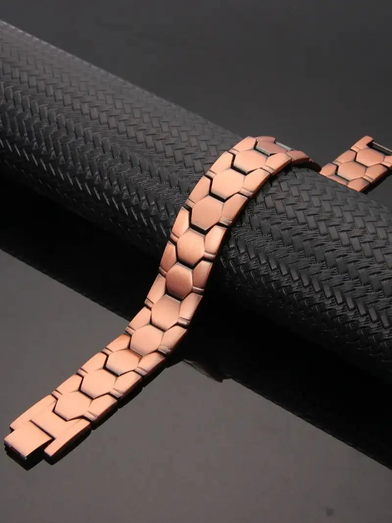 A Red Copper Magnetic Energy Bracelet with Magnets, Featuring Functions of Relieving Fatigue, Promoting Blood Circulation and Alleviating Joint Discomfort. It Is Suitable as a Gift for Father'S Day or for Giving as a Birthday Present to Elders.
