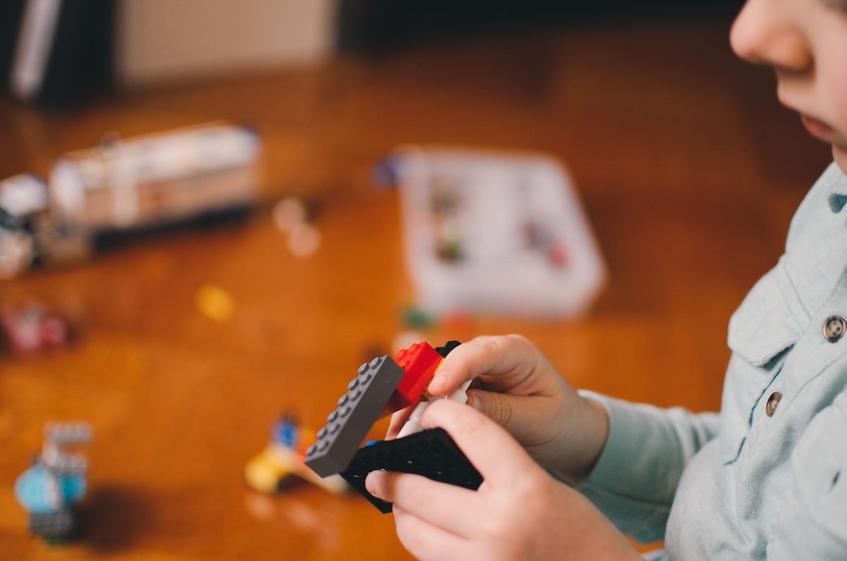 Toddler playing with building block toys