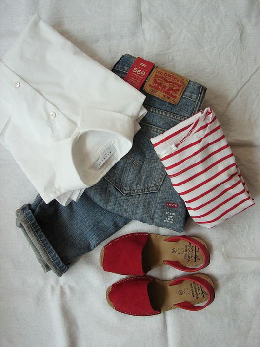 Woman's assorted clothes on hangers