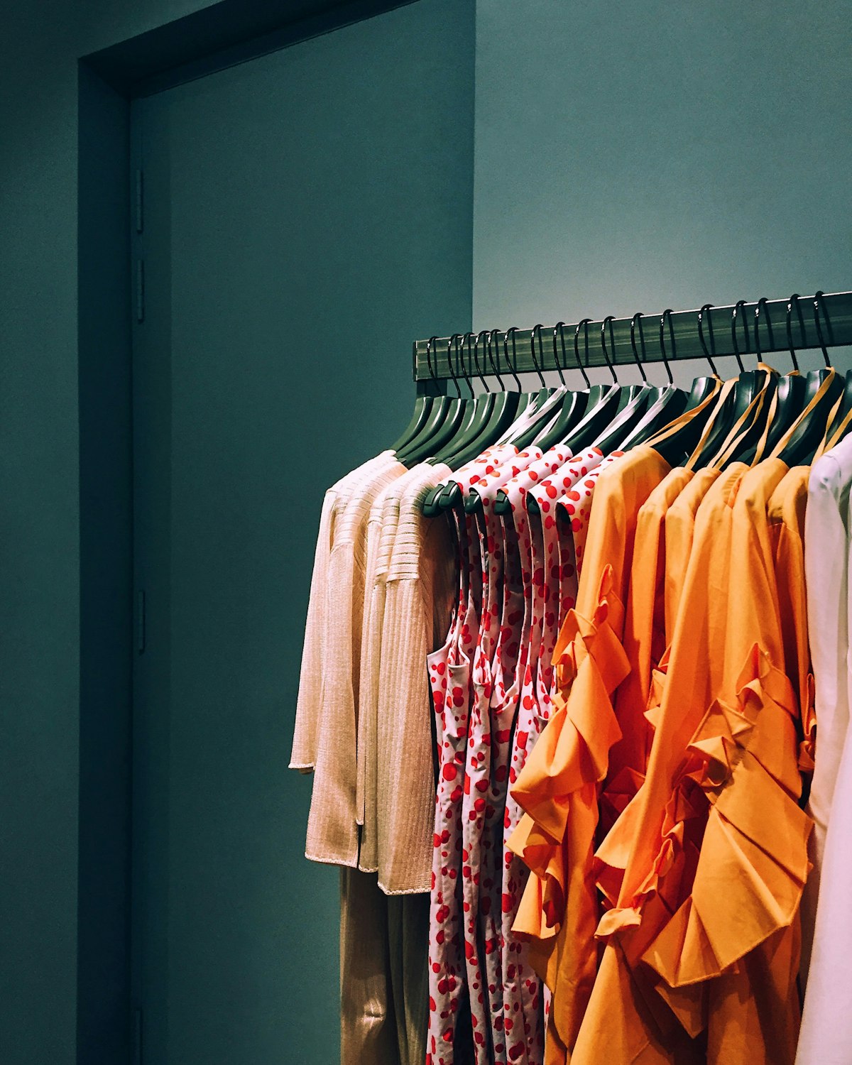 Assorted-color shirt lot hanging on rack