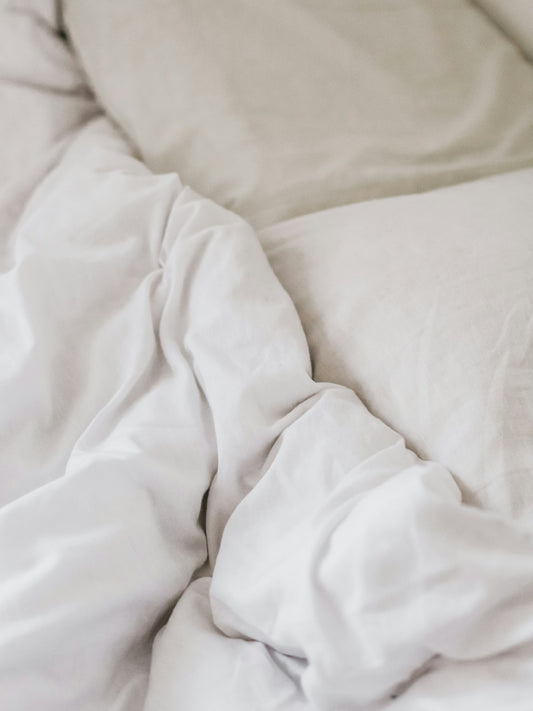 White bedspread on a bed