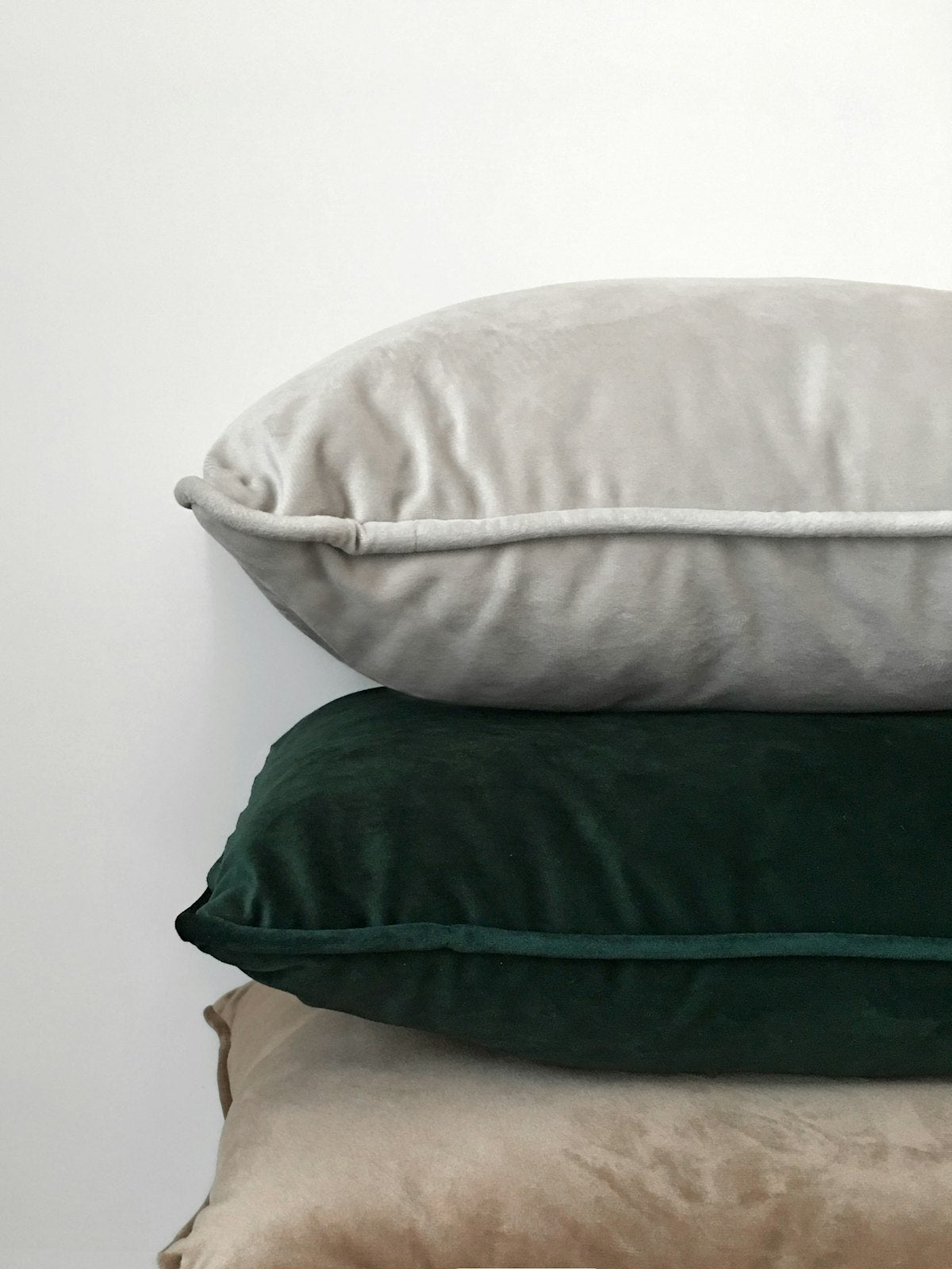 Three assorted decorative pillows