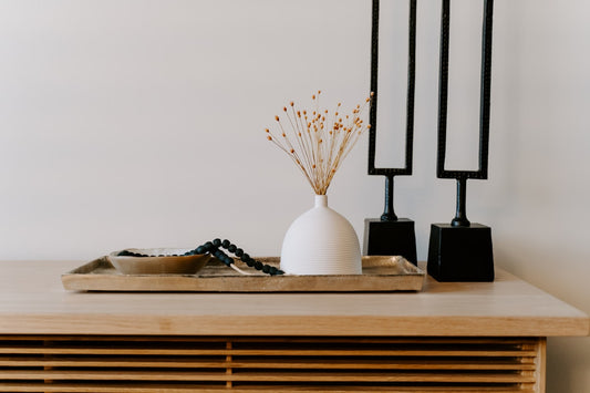 White ceramic vase with table decor