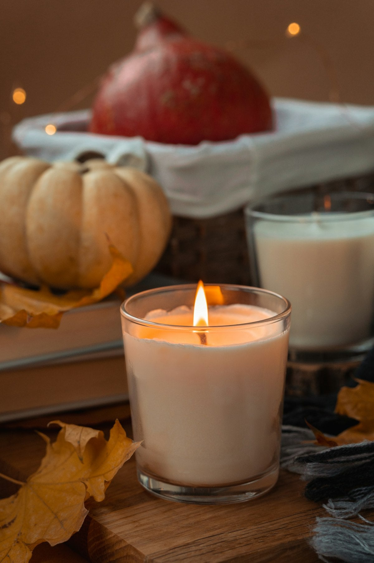 White pillar candle on a glass holder