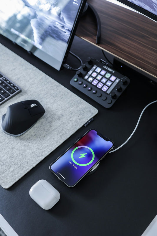 Computer mouse beside keyboard