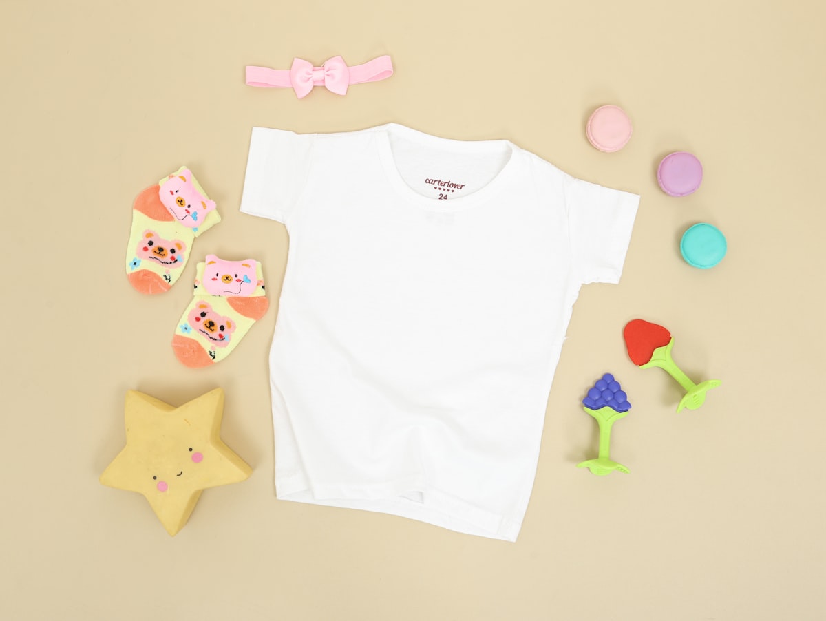 Baby's white onesie and pink bear print onesie