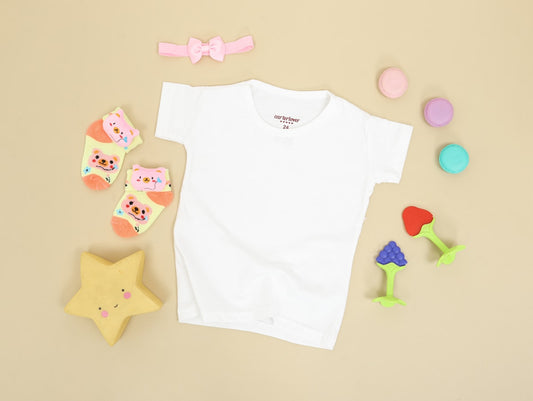 Baby's white onesie and pink bear print onesie