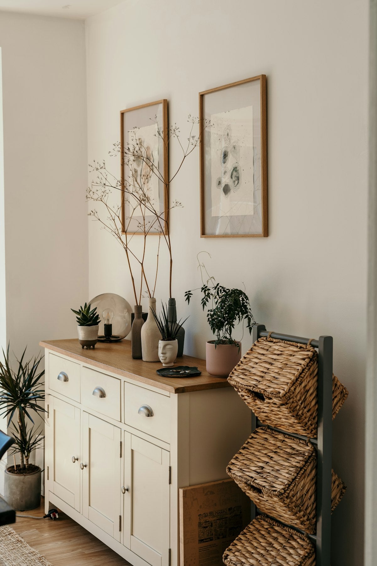 Brown woven basket on a white cabinet