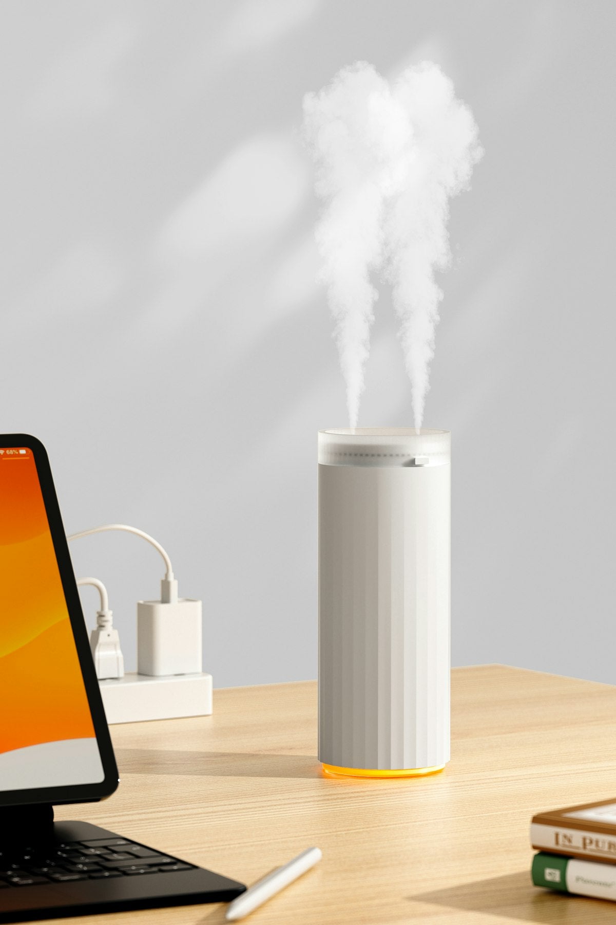 White essential oil diffuser emitting mist